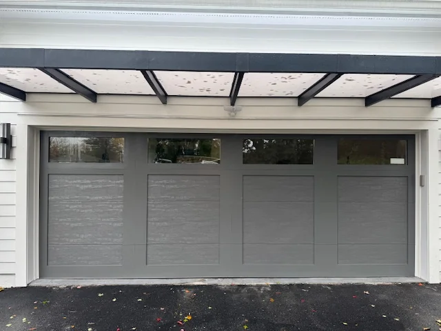 Modern carriage-house garage door installation Patterson NY — Reynolds
